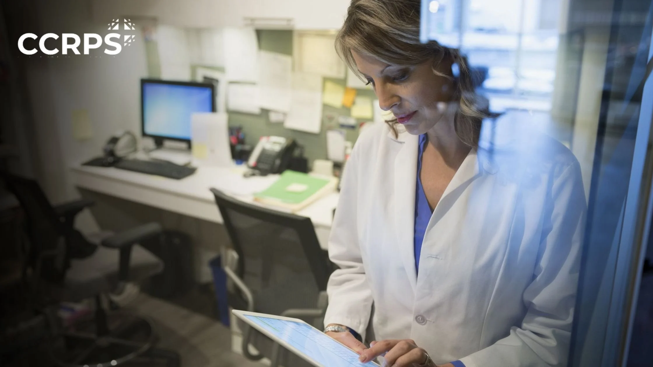 Junior Clinical Trial Coordinator managing clinical research documents and patient consent forms in office setting