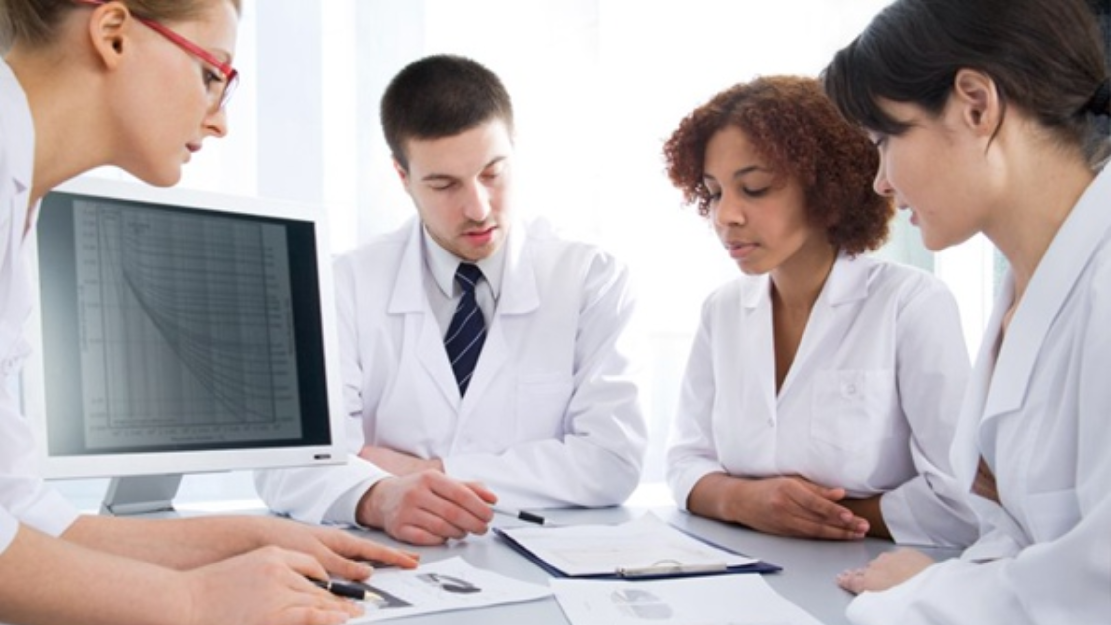 Pharmacovigilance professional processing ICSR case reports in a clinical research office environment