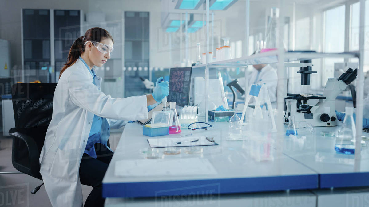 Scientists working in a pharmaceutical research laboratory conducting drug research